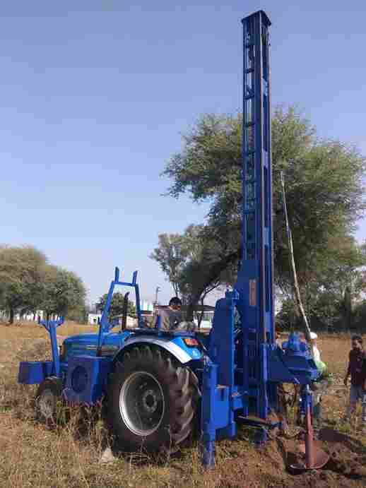 Tractor link attchment piling machine