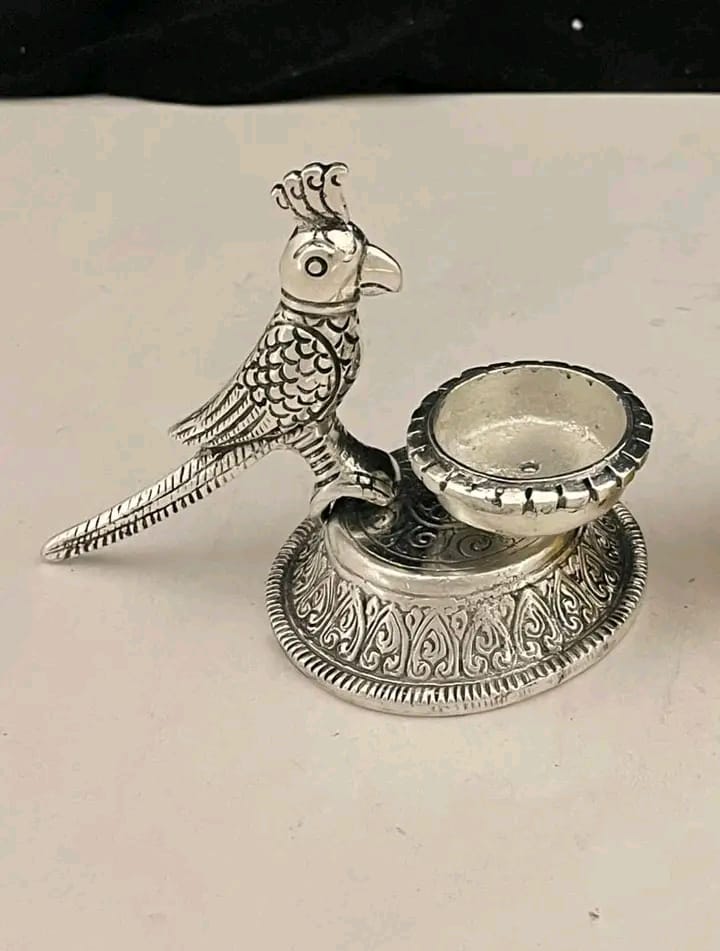 German silver stand ?parrot candle